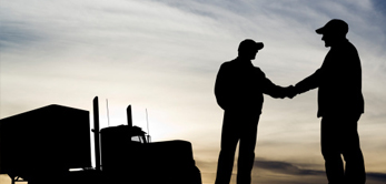 silhouette of two men shaking hands