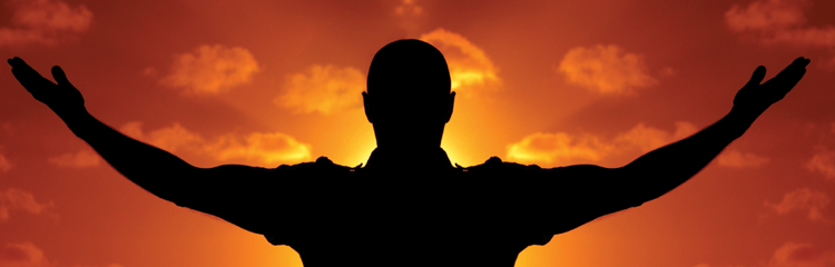 a silhouette of a man with his arms open